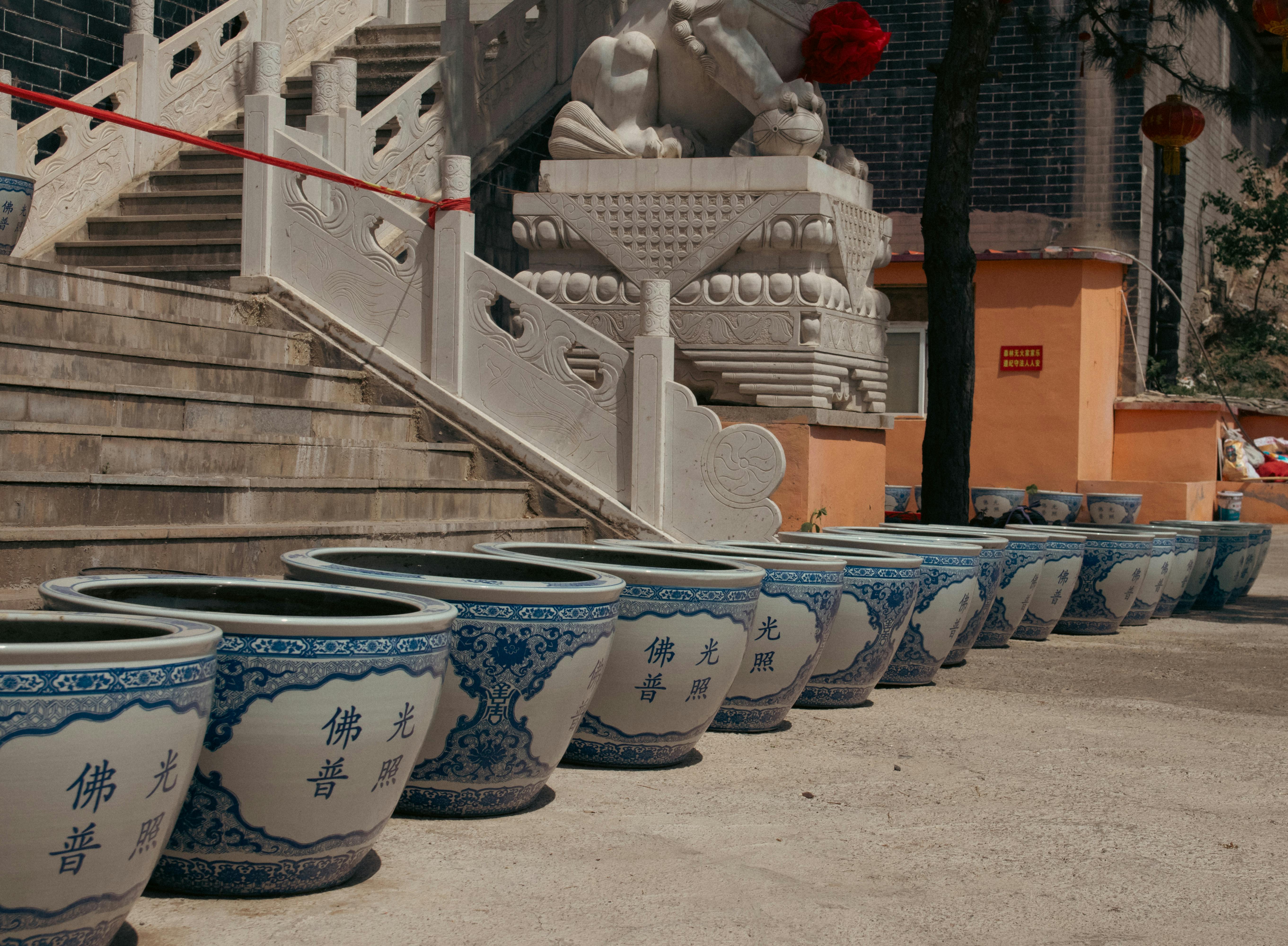 Clay Pot Artisary — collection of handcrafted Chinese clay pots, sand pots and Yixing teapots on a dark stone surface